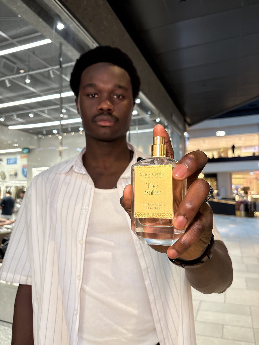 Holding a Maison Carthia bottle