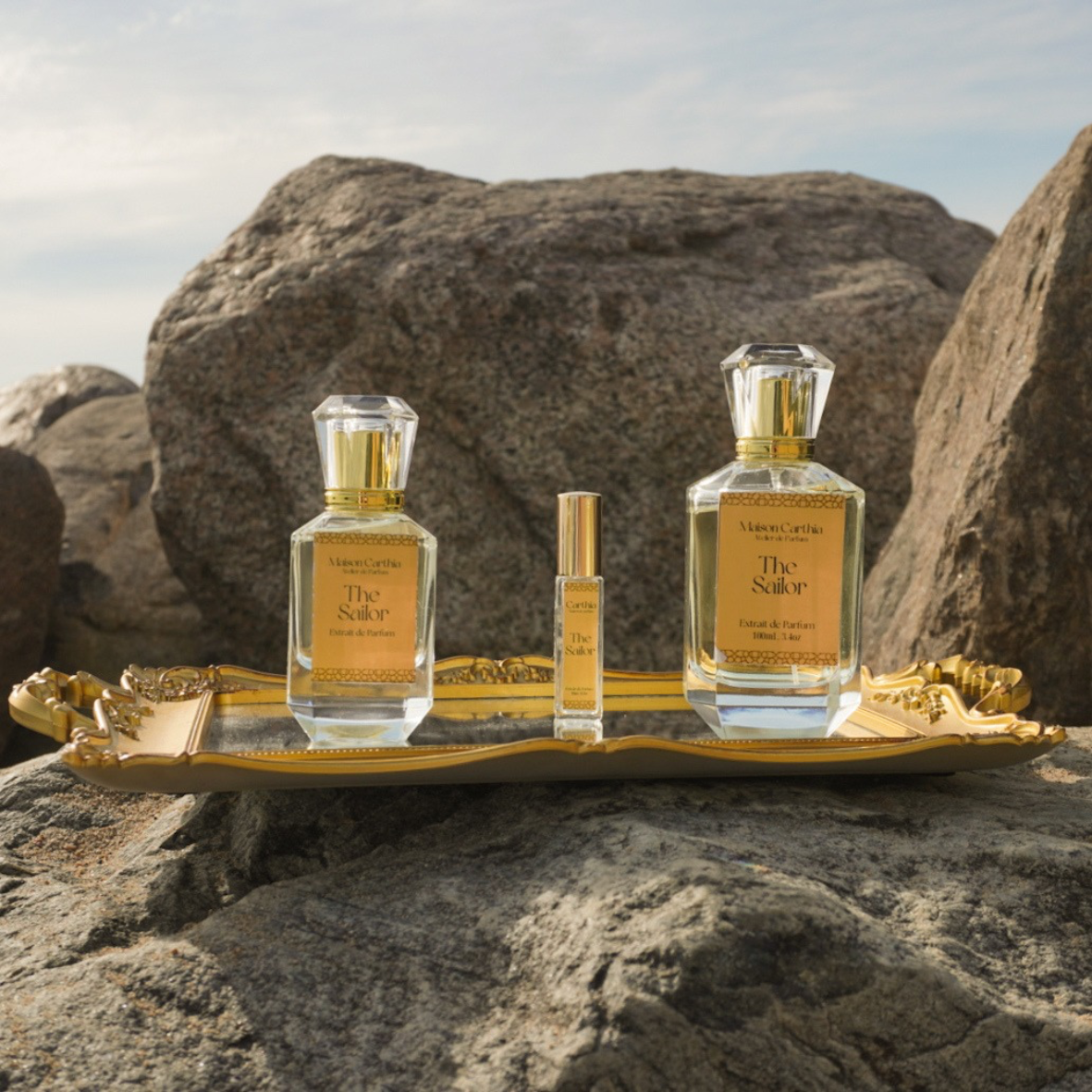 Maison Carthia bottles resting on rock outdoors